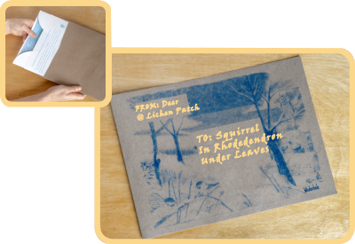 Matching brown paper envelope printed with winter scene.